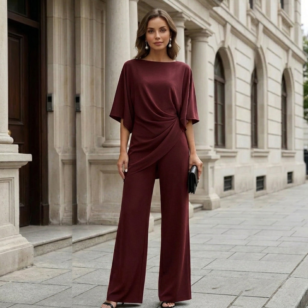 Burgundy draped cape sleeve set on a city street