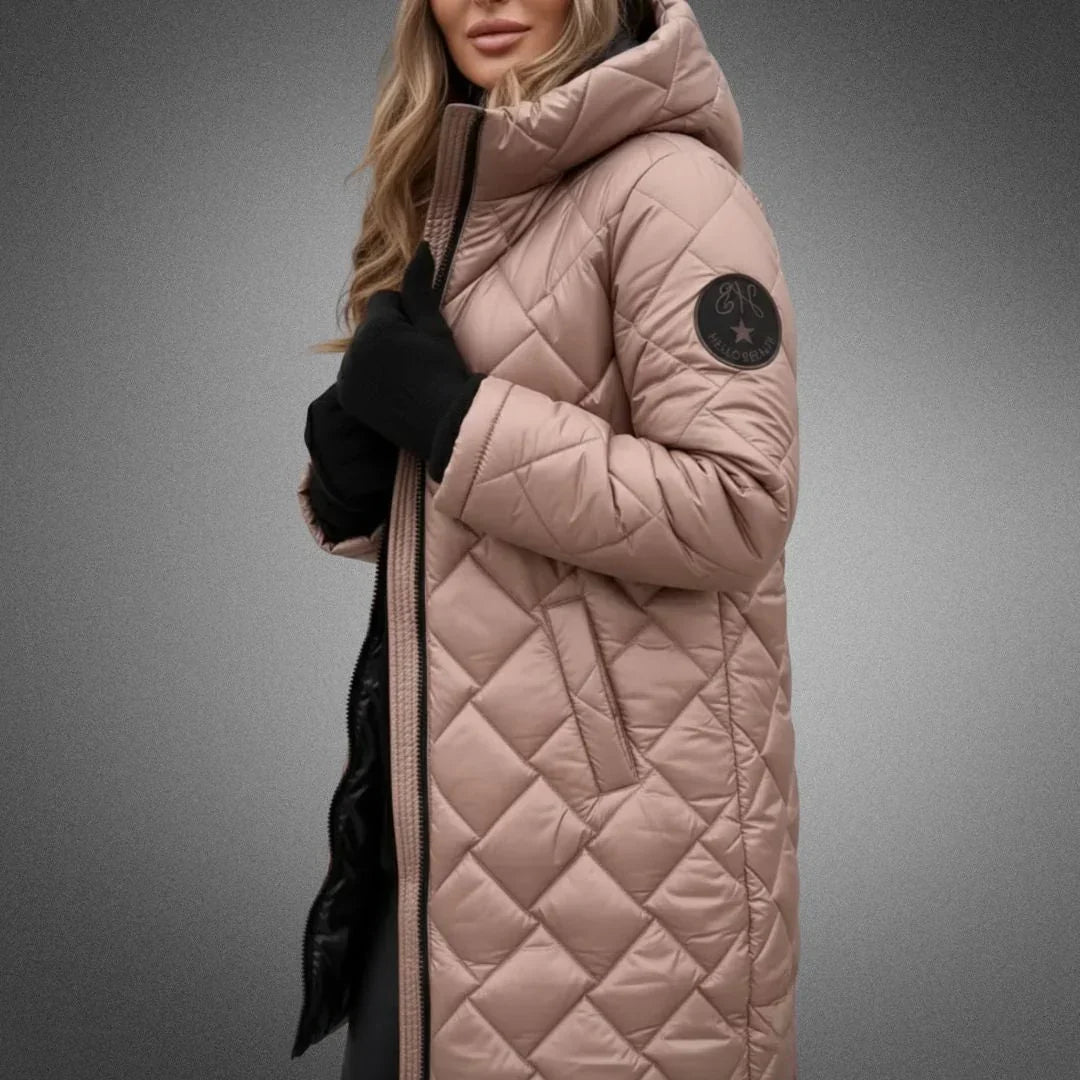Dusty pink diamond quilted longline coat with the hood up