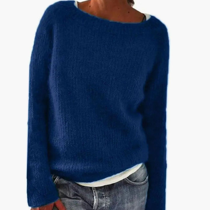Navy blue relaxed fit boat neck sweater in soft knit, worn with light jeans