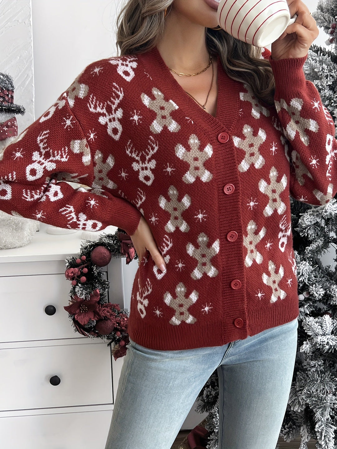 Rust red knit button cardigan with gingerbread man and reindeer pattern, front view