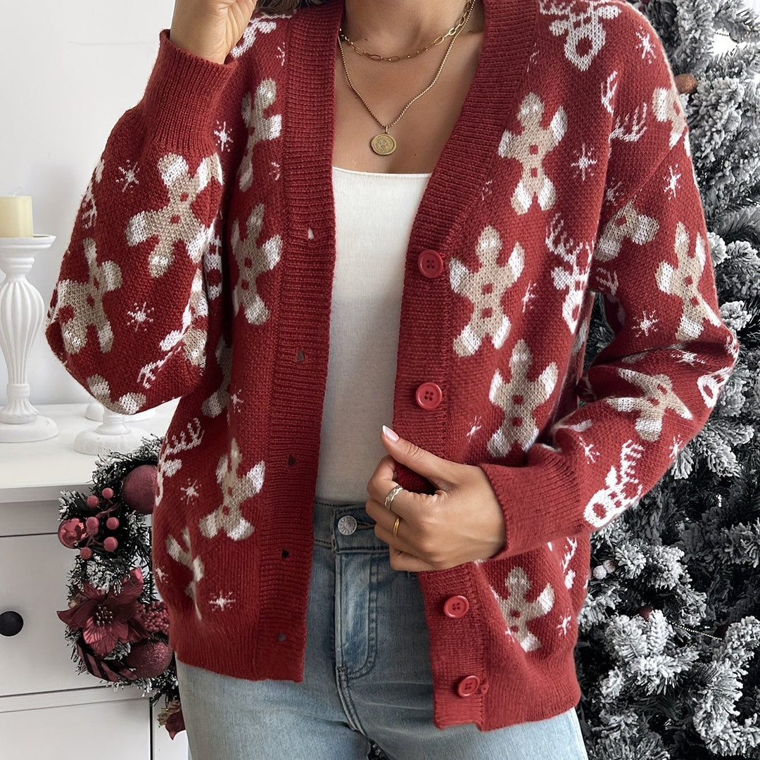 Red knit cardigan with gingerbread, reindeer and snowflake pattern and a buttoned front
