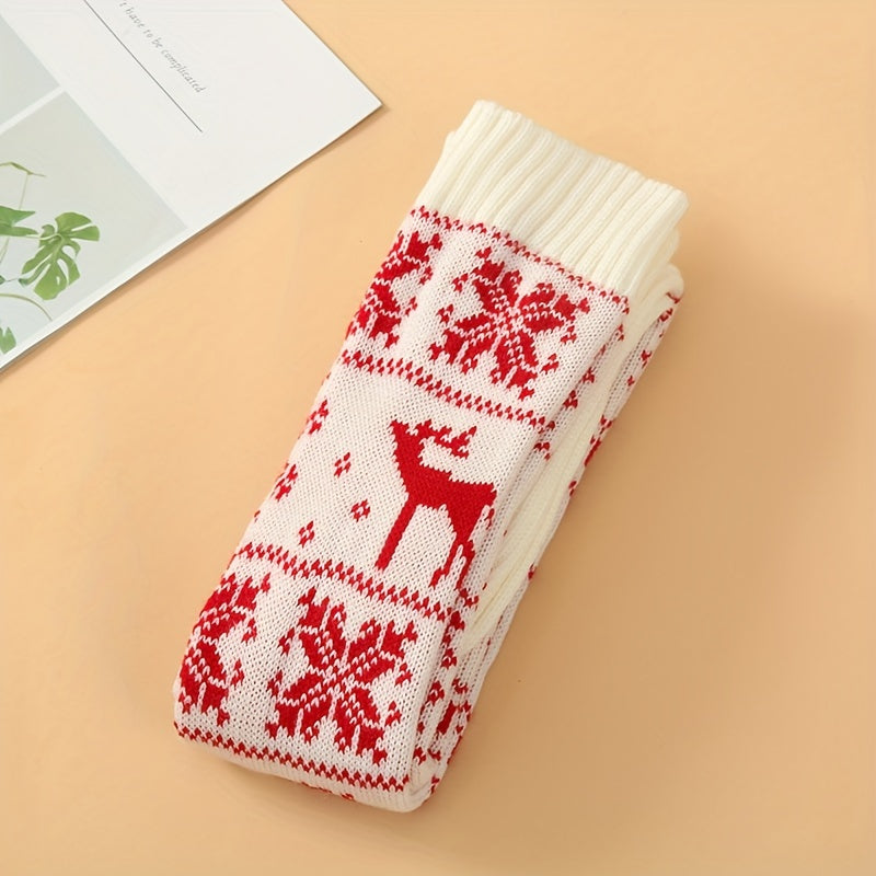 Folded cream knee high socks with a red reindeer and snowflake knit pattern