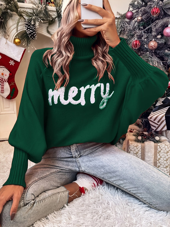 Green turtleneck sweater with batwing sleeves and white merry lettering, worn with jeans