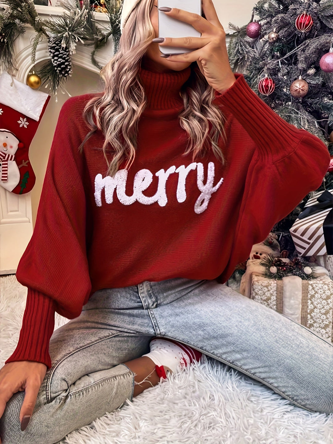 Deep red batwing turtleneck sweater with fluffy white merry lettering, front view