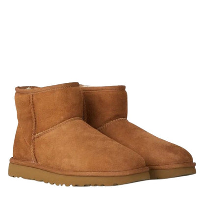 Pair of camel suede fleece lined ankle boots, side view