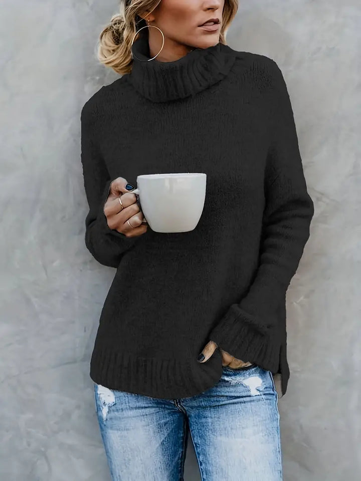 Black turtleneck sweater with a rolled collar and ribbed hem, front view