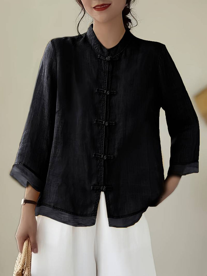 Black linen blouse with knotted frog closures and a mandarin collar