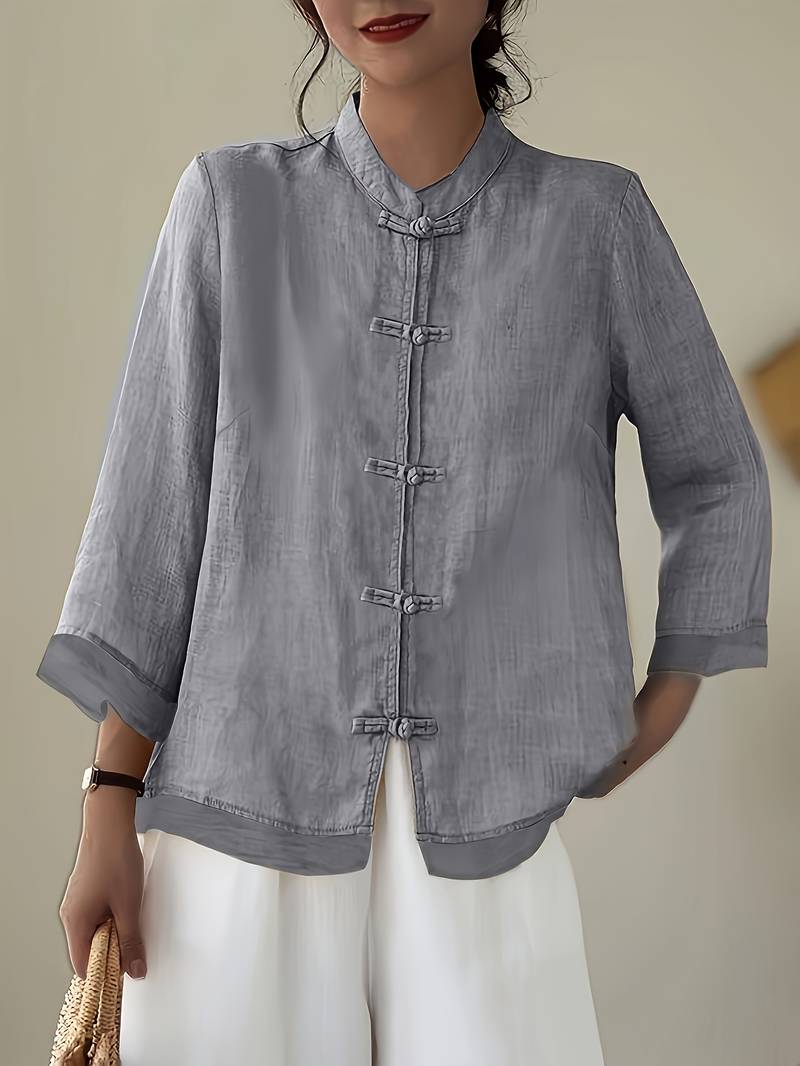 Grey linen blouse with knotted frog closures and three quarter sleeves
