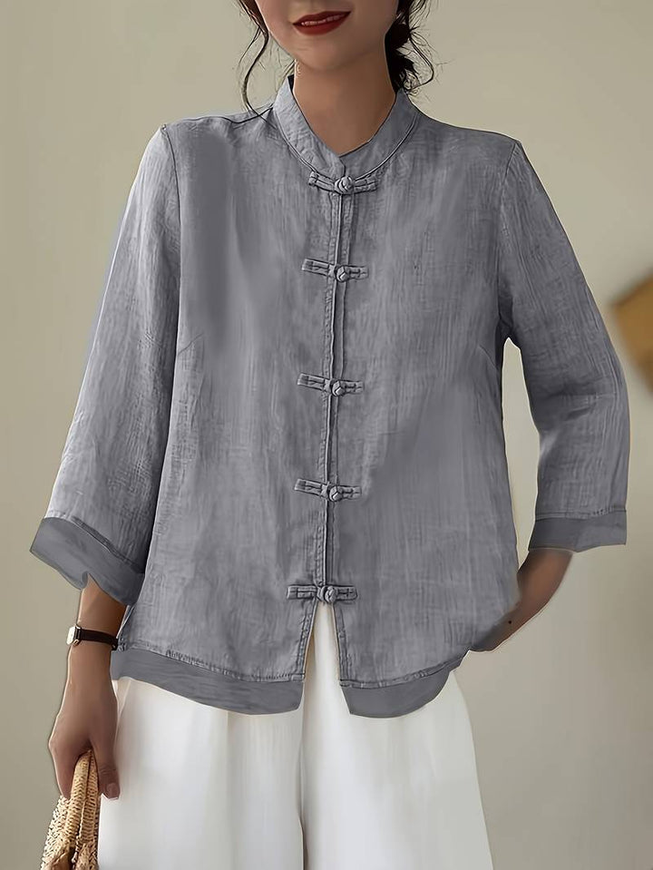 Grey linen blouse with knotted frog closures and three quarter sleeves