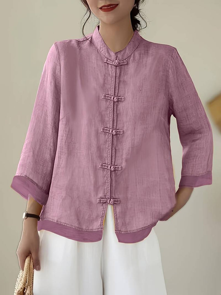 Pink linen blouse with knotted frog closures and turn back cuffs