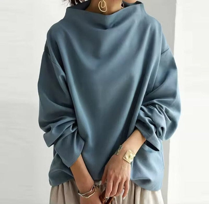 Blue grey funnel neck dolman top with gathered sleeves, front view