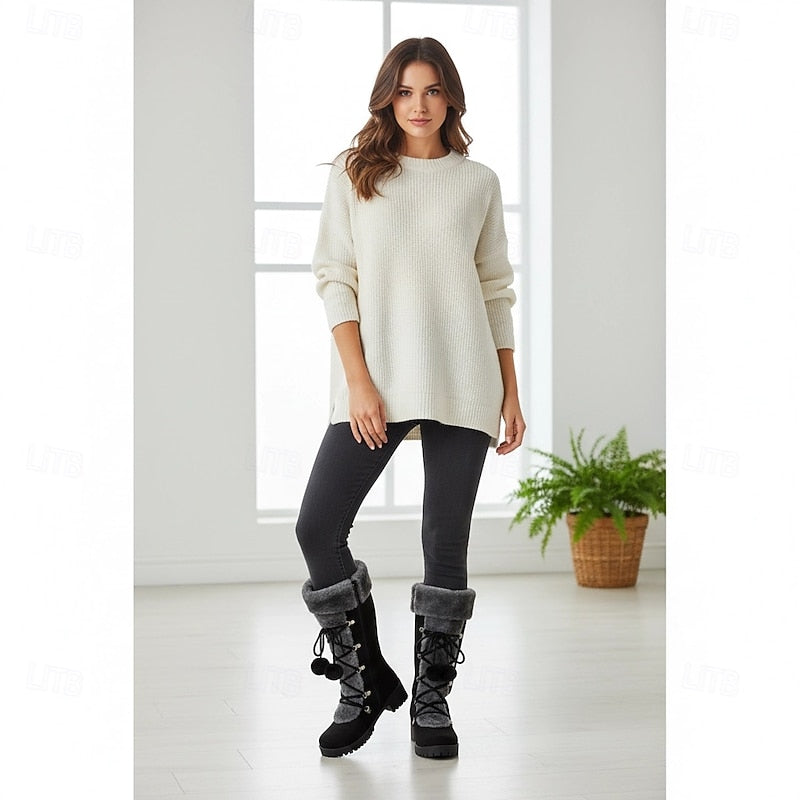 Fur cuff lace boots worn with leggings and a knit sweater indoors