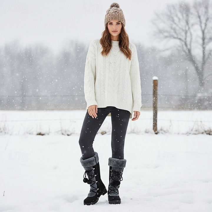 Fur cuff lace boots worn with leggings and a knit sweater outdoors