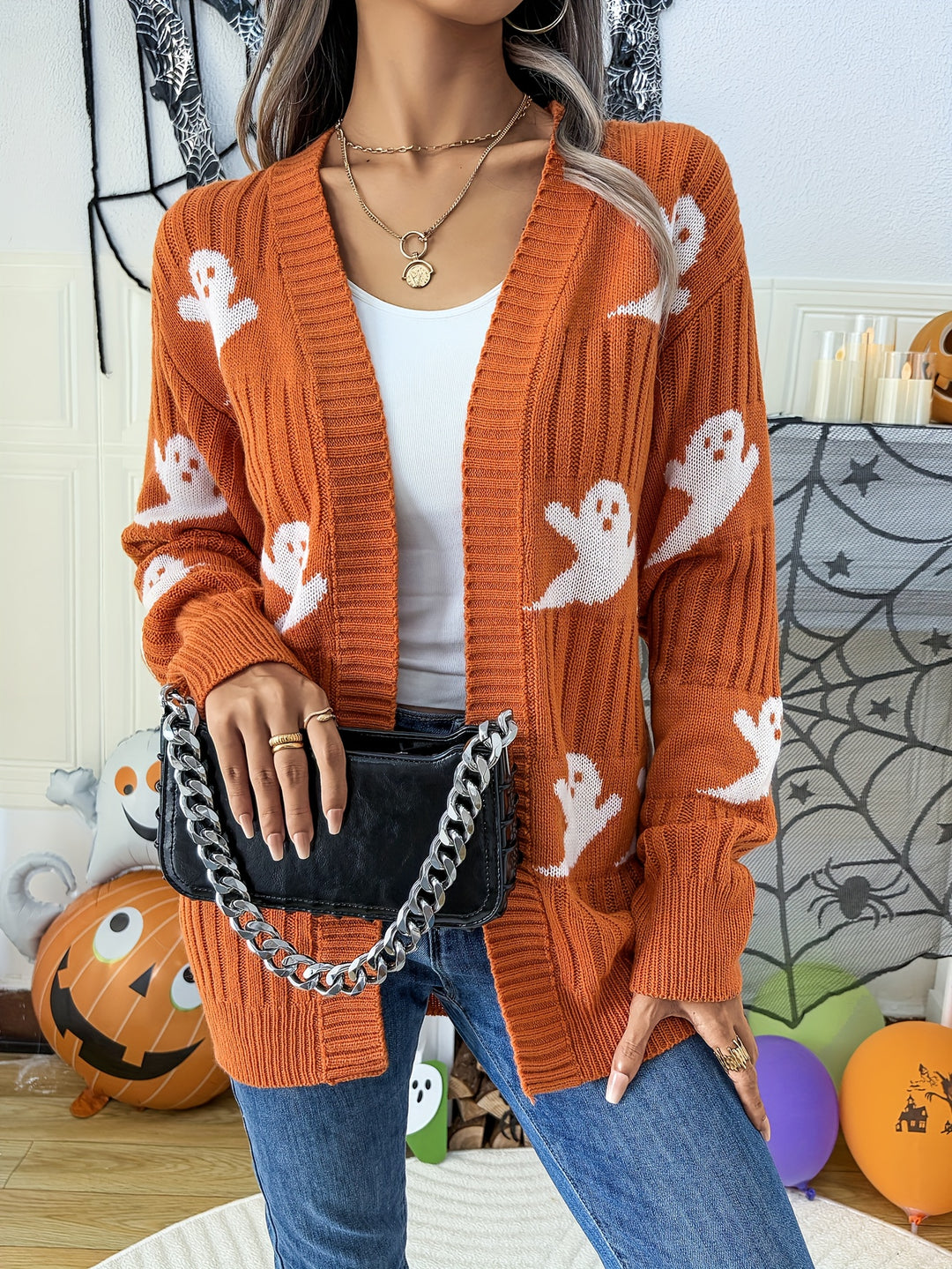 Orange ghost print open front cardigan with ribbed knit and drop shoulders