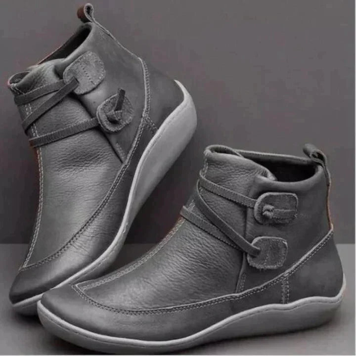 Gray side lace ankle boots seen from the outer side