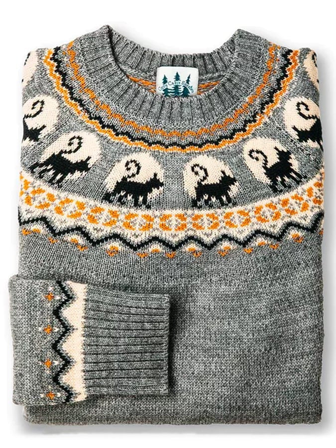 Folded grey fair isle sweater with black cat and ghost pattern in cream and orange