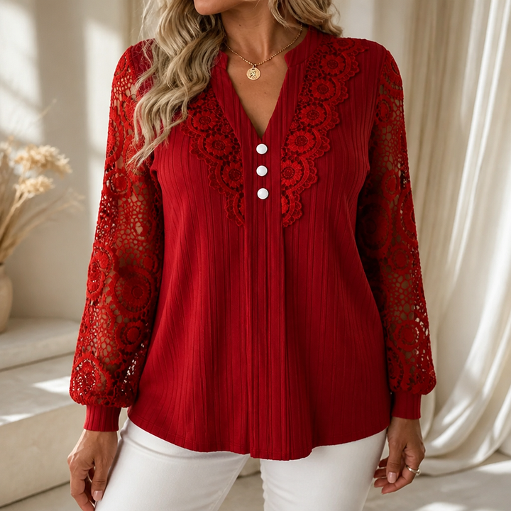 Red ribbed V neck top with floral lace sleeves and three white buttons