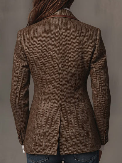 Back view of the brown herringbone blazer with a center vent