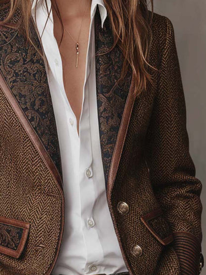 Close-up of the paisley lapels framing a white shirt