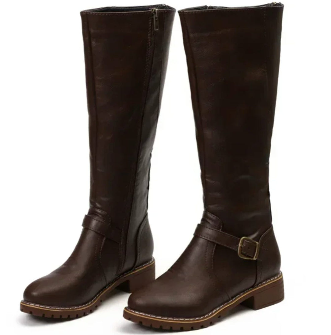 Pair of dark brown knee high riding boots with ankle buckle strap and block heel