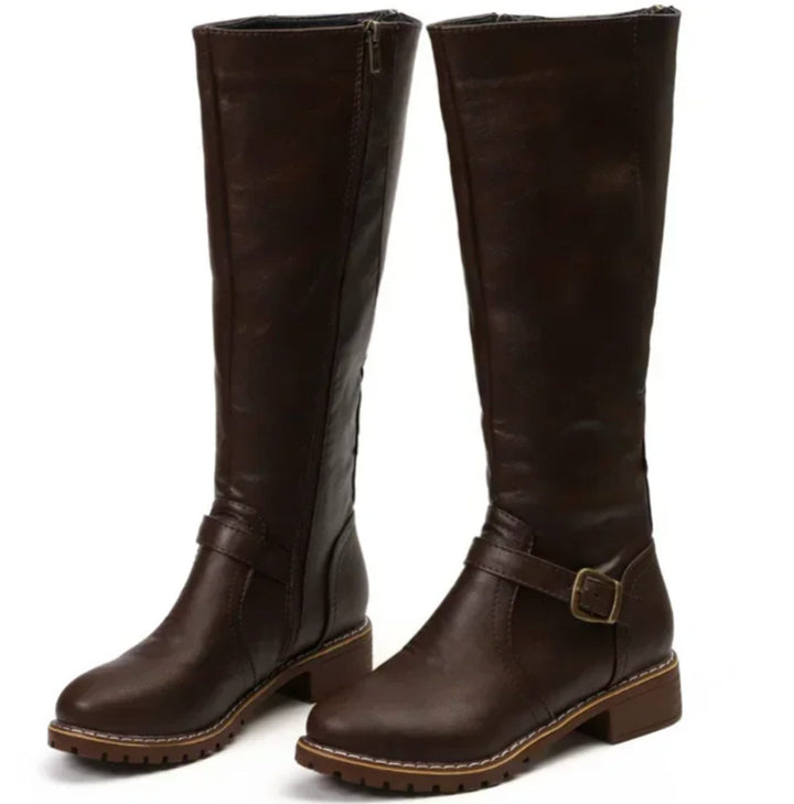 Pair of dark brown knee high riding boots with ankle buckle strap and block heel