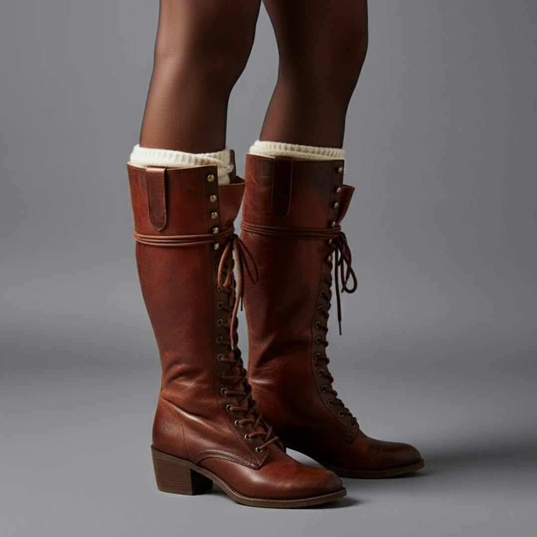Brown lace up knee high boots worn with cream boot socks