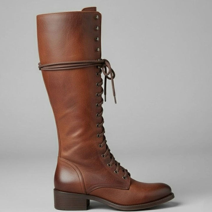 Side view of a brown leather knee high lace up boot with block heel