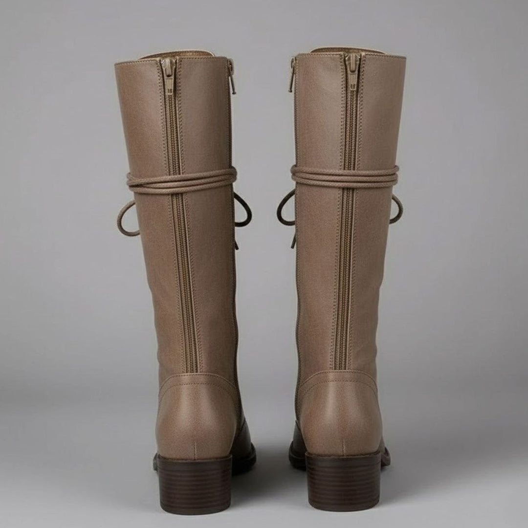 Taupe knee high boots seen from the back with rear zip and wrap around laces