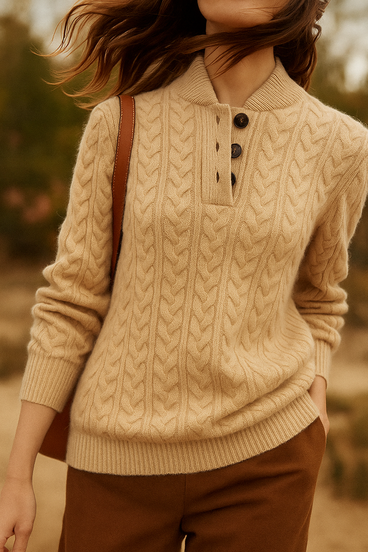 Khaki cable knit sweater with a stand collar, worn with a shoulder bag outdoors