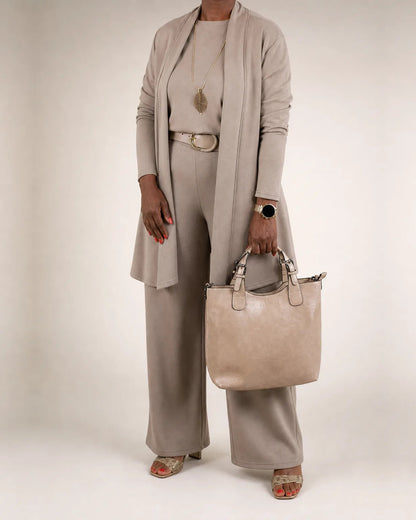 Taupe three-piece knit set styled with a belt and a tote