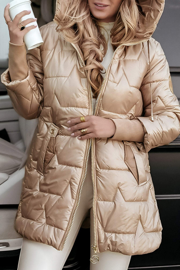 Beige glossy longline puffer coat with a drawstring hood, three quarter view