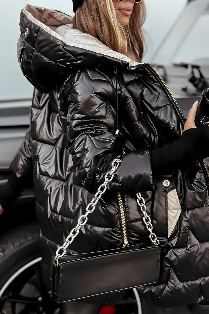 Black glossy longline puffer coat with contrast hood lining, side view