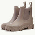 Taupe waterproof chelsea rain boots with chunky lug sole, angled pair view
