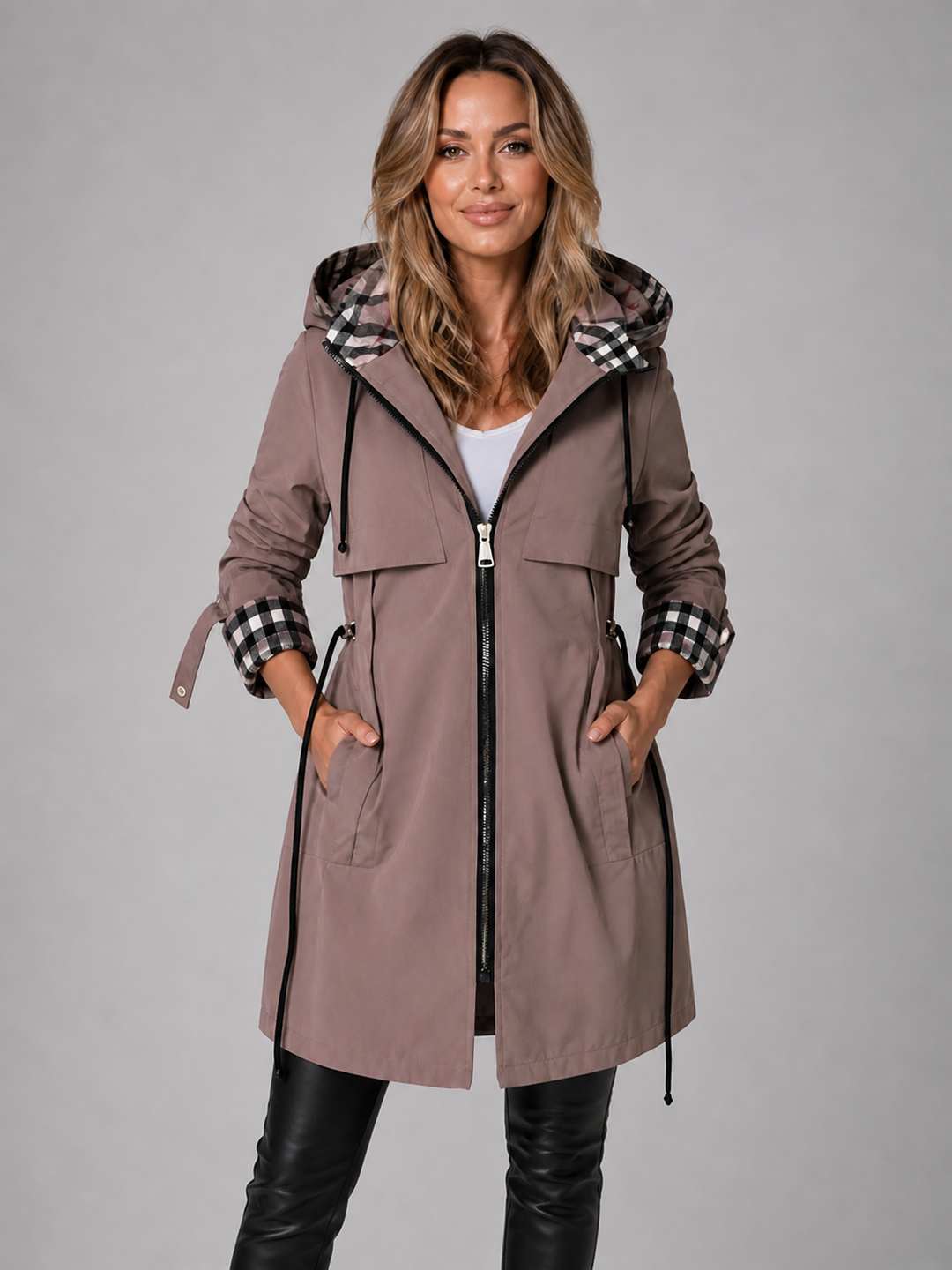 Mauve hooded parka with a check lined hood, worn zipped