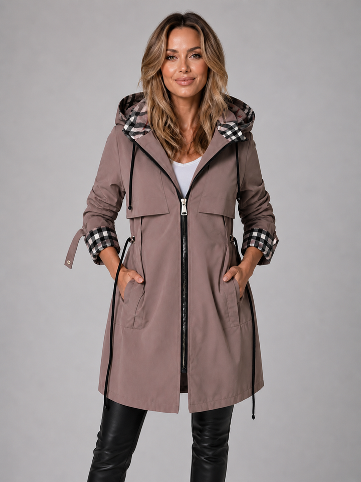 Mauve hooded parka with a check lined hood, worn zipped