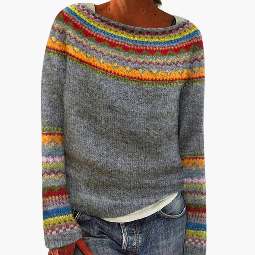 Grey boat neck sweater with a multicoloured fair isle yoke and patterned cuffs