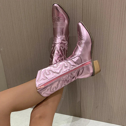 Pink metallic western boot with a side zip, raised leg view