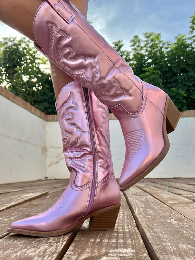 Pink metallic western knee boots worn outdoors