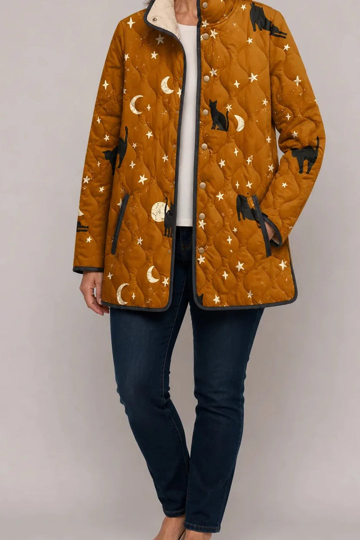 Mustard quilted jacket with a cat, moon and star print