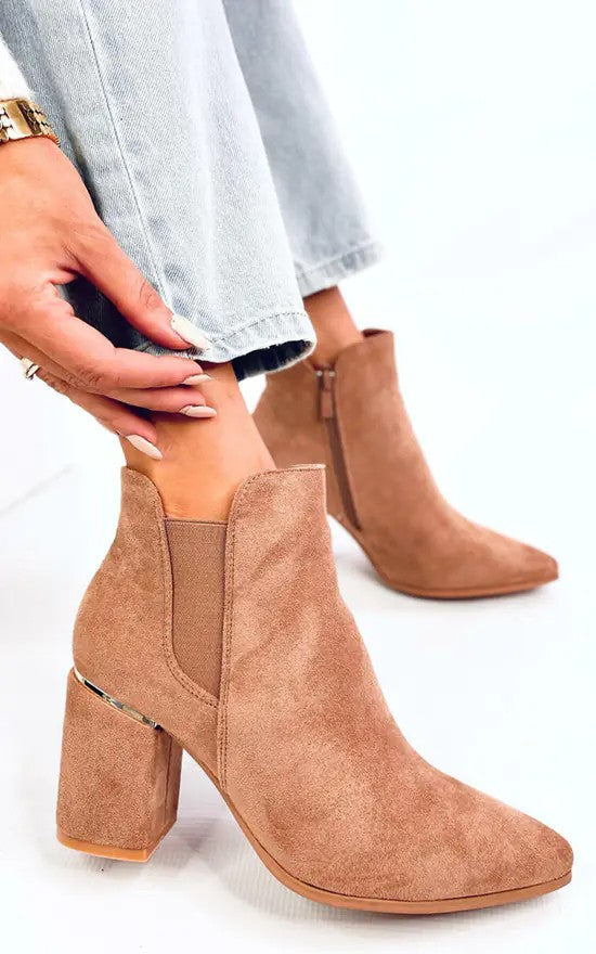 Nude suede ankle boots worn with cuffed jeans