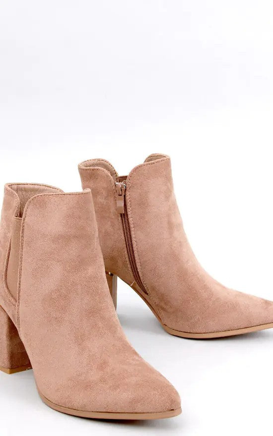 Pair of nude pink suede ankle boots with block heels