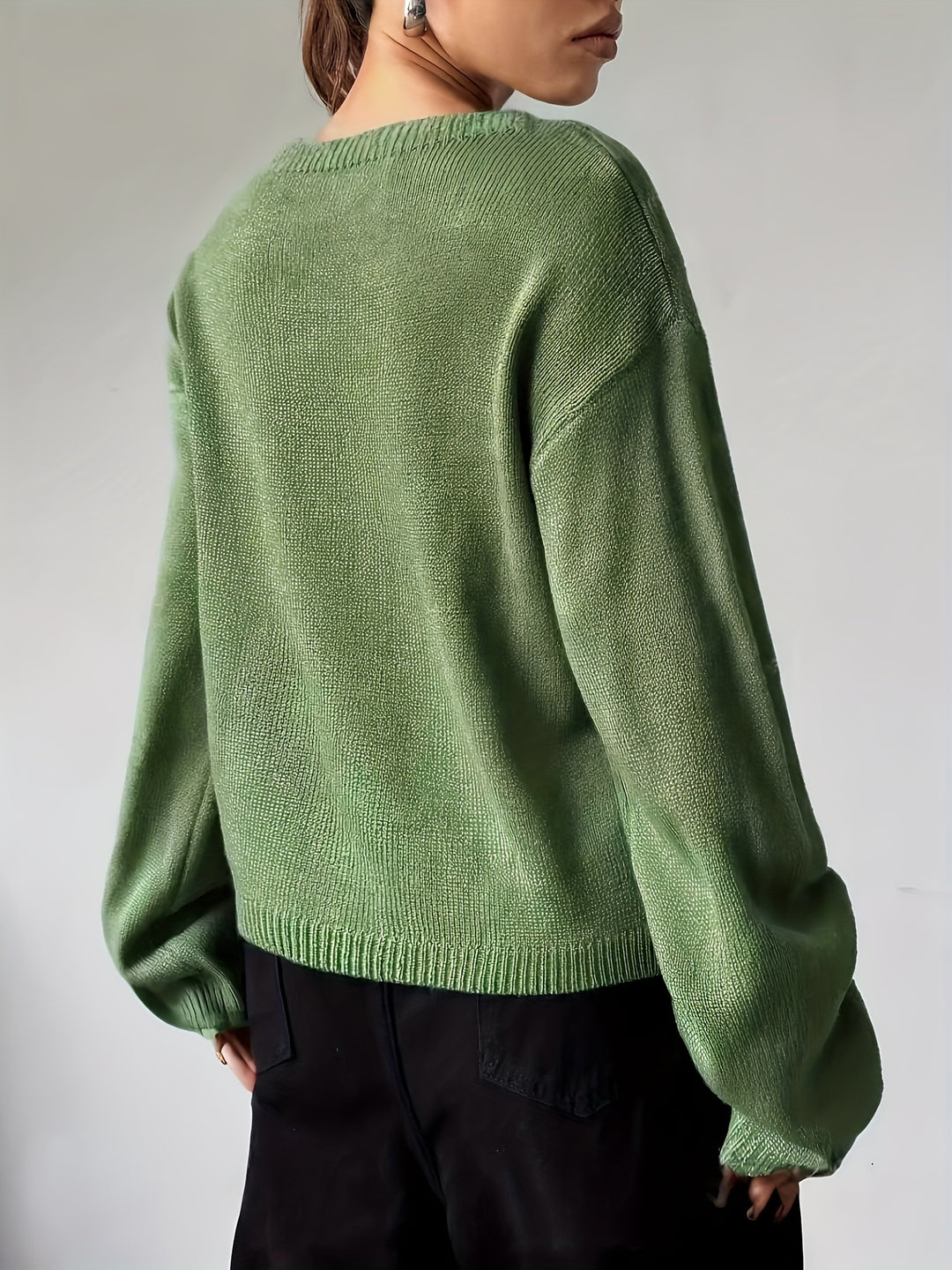 Back view of an olive green drop shoulder crew neck sweater