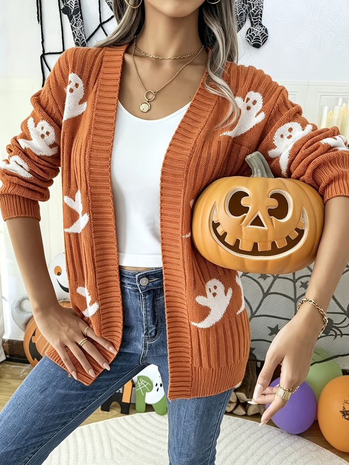 Orange open front knit cardigan with white ghost pattern, worn over a white top with jeans
