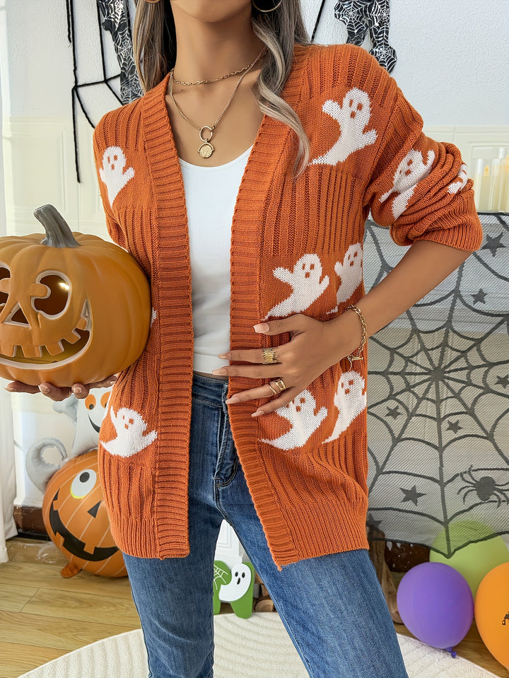 Orange ribbed open front cardigan with white ghost motifs, worn with jeans