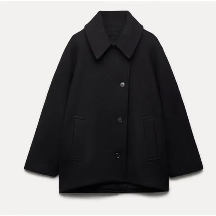 Black oversized cropped peacoat laid flat with welt pockets