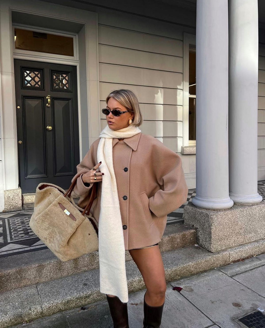 Camel oversized cropped peacoat over a long white knit, street view