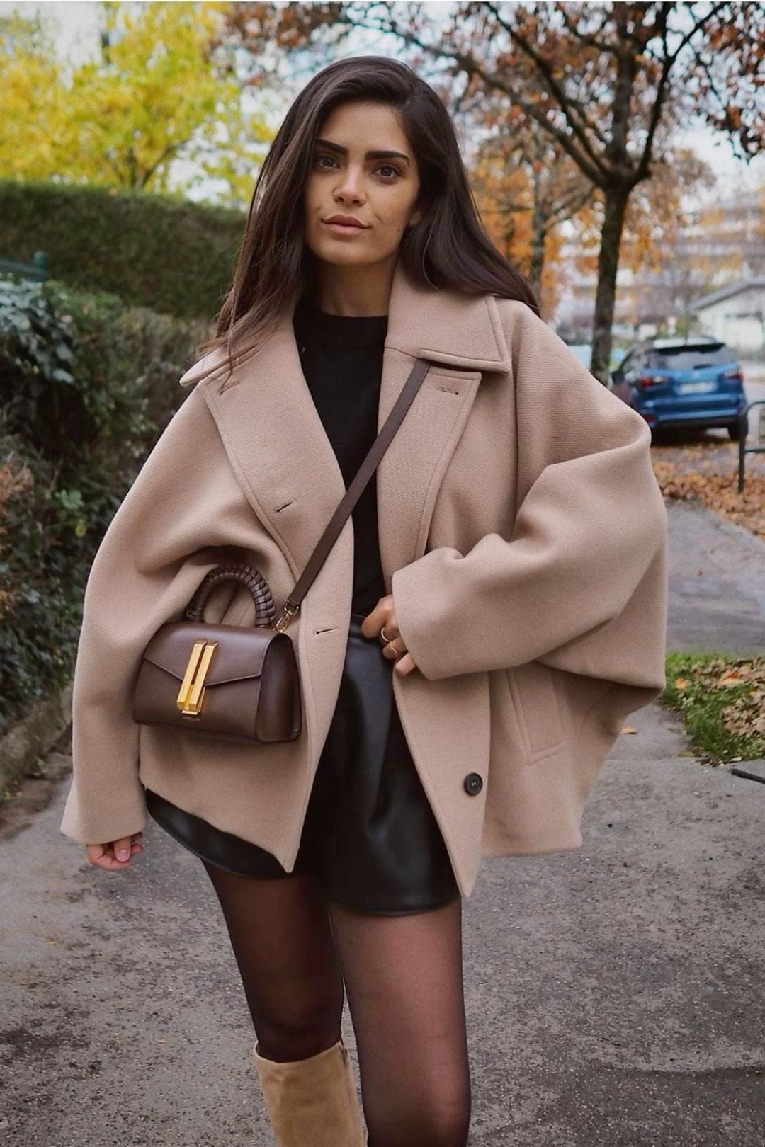 Camel oversized cropped peacoat with a leather skirt, front view