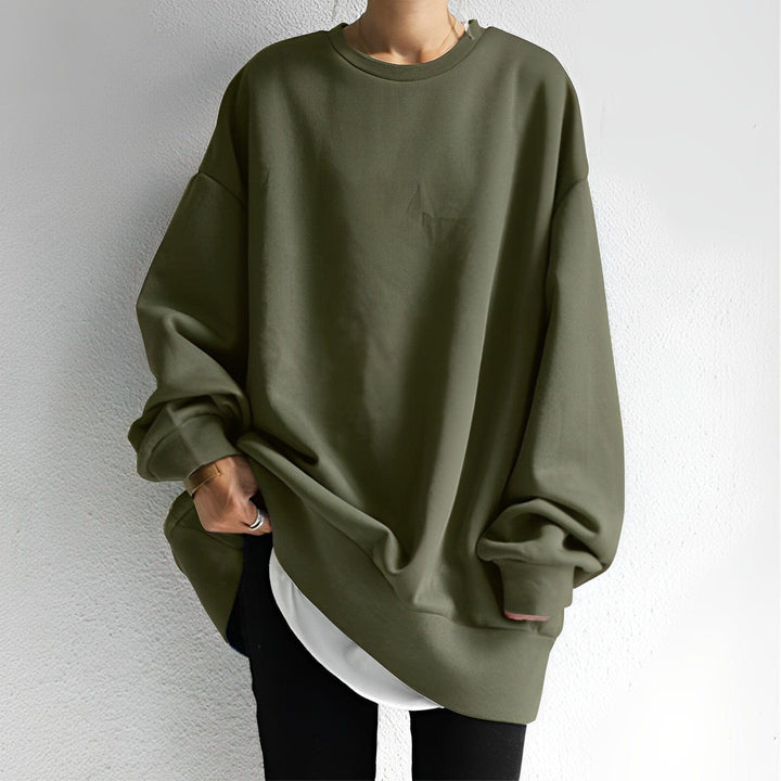 Olive oversized crew neck sweatshirt falling past the hip, front view