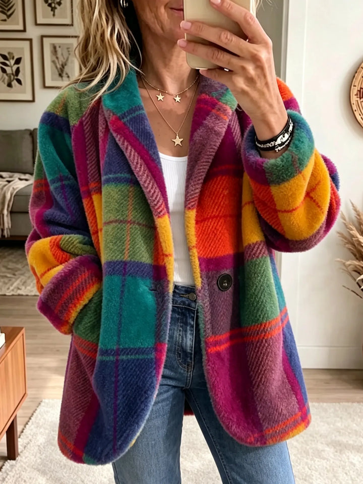 Multicolor plaid lapel coat worn open over a white top, front view