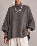 Taupe oversized turtleneck sweater with ribbed balloon sleeves, front view